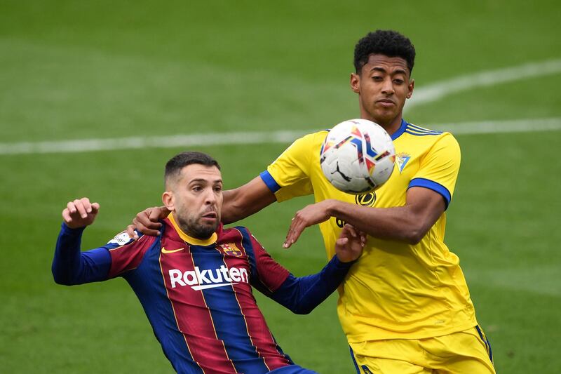 Barcelona defender Jordi Alba and Cadiz forward Anthony Lozano battle for the ball. AFP