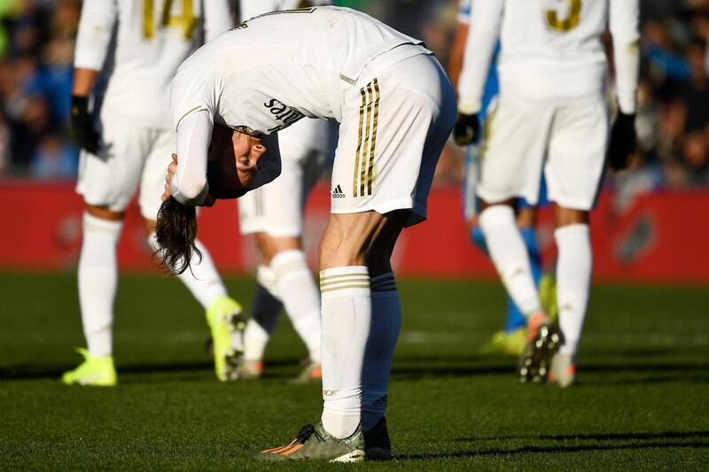 Real Madrid forward Gareth Bale arranges his ponytail. AFP