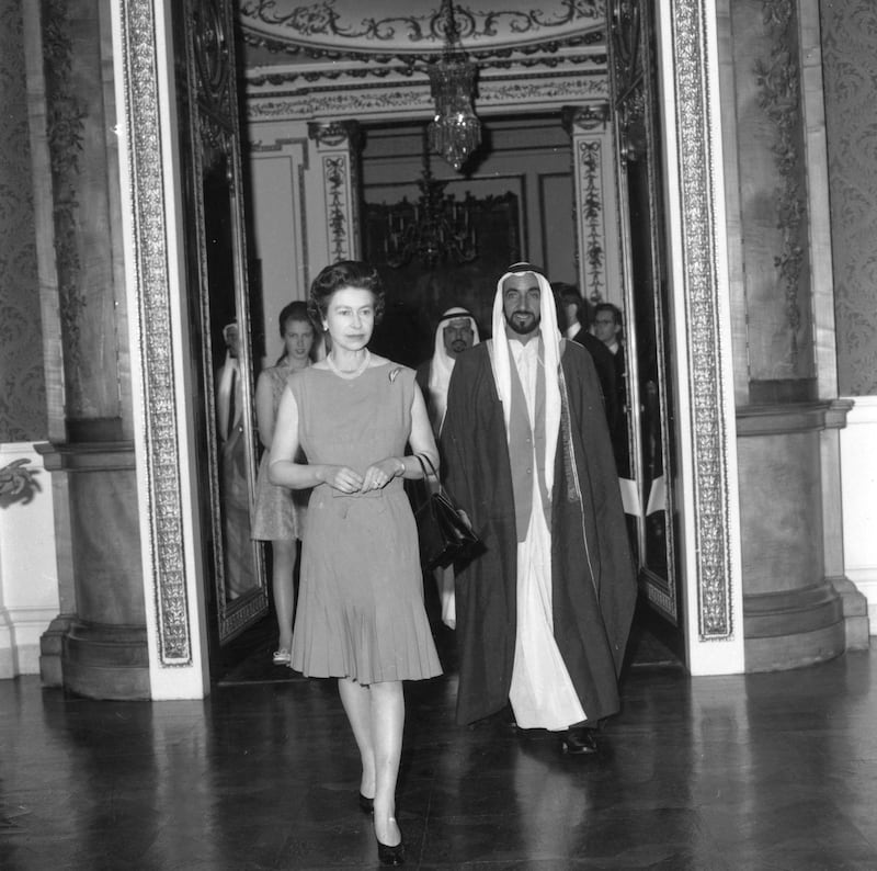 13th June 1969:  Queen Elizabeth II leading Sheikh Zayed, ruler of Abu Dhabi through Buckingham Palace, London.  (Photo by Tim Graham/Fox Photos/Getty Images)