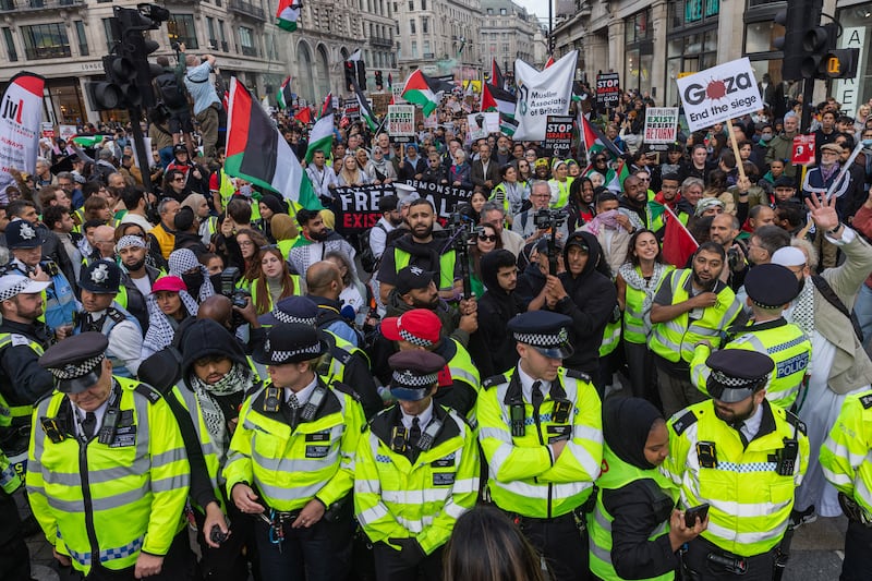 Police officers form a cordon during a pro-Palestine demonstration on Westminster Bridge. Getty Images