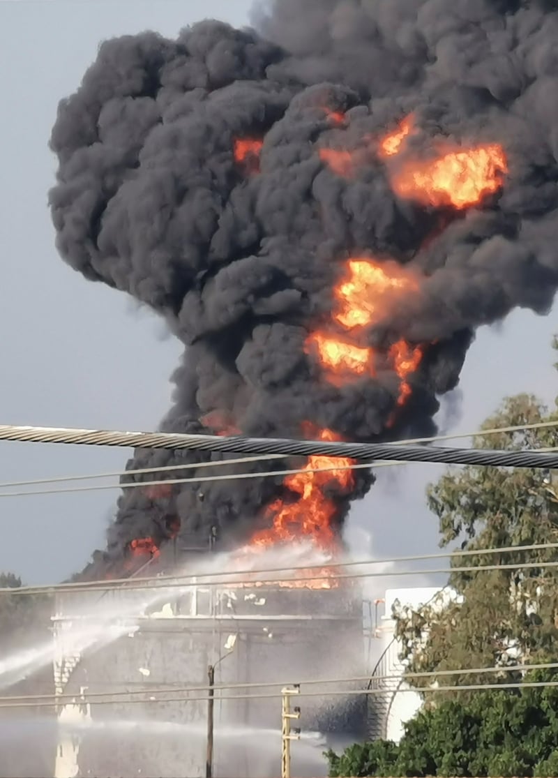 Fire crews spray water at the blaze. Reuters