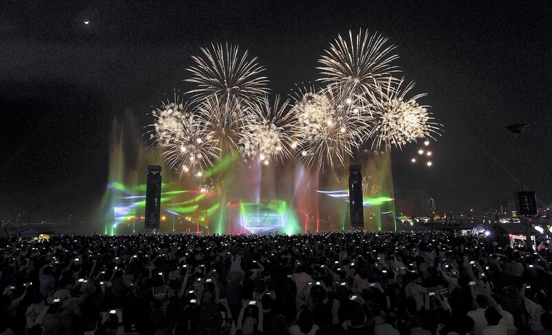 Dubai, Decemeber, 02 2019: People enjoy the fireworks at the Dubai Festival City in Dubai . Satish Kumar/ For the National