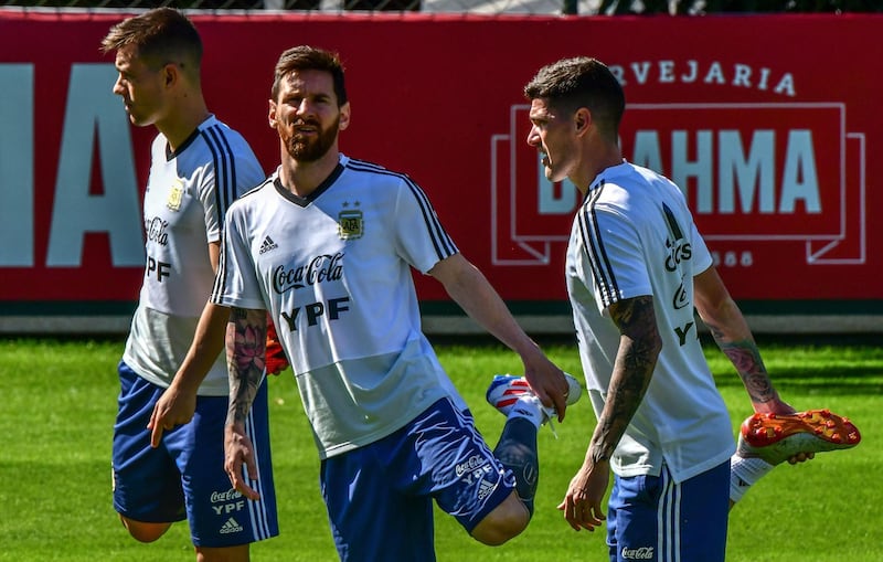 From left: Giovani Lo Celso, Lionel Messi and Rodrigo De Paul do some warm-ups. AFP