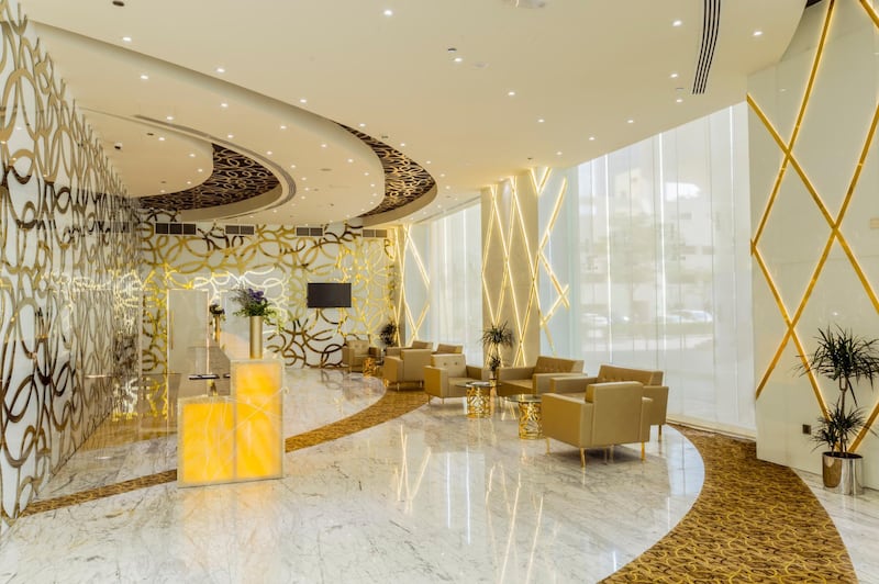 The gold-themed lobby of the Gevora Hotel.