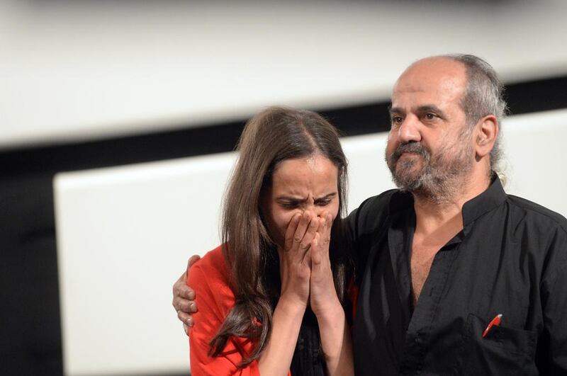 The Syrian directors Wiam Simav Bedirxan, left, and Ossama Mohammed react to the standing ovation at the screening of their film Silvered Water, Syria Self-Portrait at the Cannes Film Festival in May. Ammar Abd Rabbo / AFP