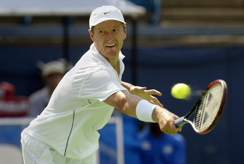 Yevgeny Kafelnikov of Russia stretches out but misdirects a serve from Nicolas Kiefer of Germany during the 2003 RCA Championships at the Indianapolis Tennis Center 24 July, 2003 in Indianapolis, Indiana.  Kiefer won 6-3, 6-4.  (Brian Bahr/Getty Images/AFP)  FOR NEWSPAPER AND TV USE ONLY
