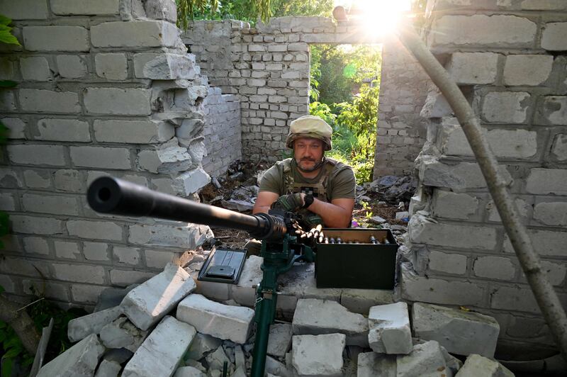 A Ukrainian serviceman keeps his position not far from the Ukrainian town of Chuguiv, in Kharkiv region. AFP