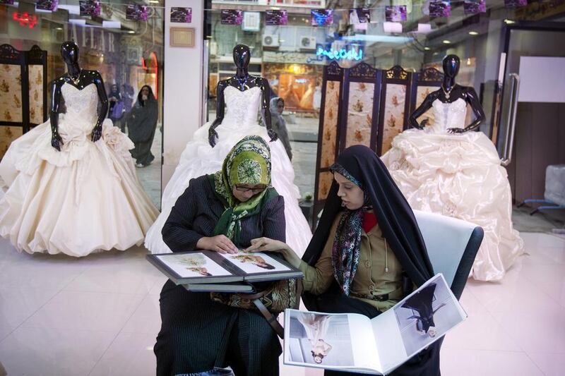Iranian women shop for a bridal gown in Tehran. Maryam Rahmanian for The National