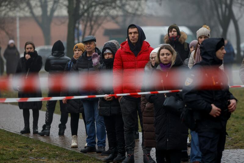 Onlookers gather at the scene. Reuters