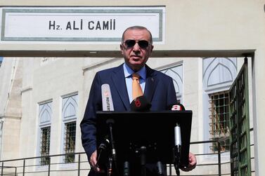 Turkey's President Recep Tayyip Erdogan talks to the media following Friday prayers at a mosque in Istanbul, Friday, Sept. 18, 2020. AP