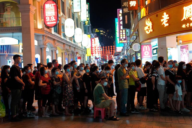 Residents queue for coronavirus testing in Liwan district in the city of Guangzhou in southern China's Guangdong province, following an upsurge in infections that has alarmed authorities there. AP Photo