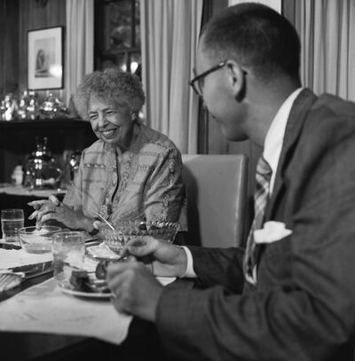 Eleanor Roosevelt enjoys dinner with a male friend at her home in Hyde Park. | Location: Hyde Park, New York, USA.  (Photo by Genevieve Naylor/Corbis via Getty Images)