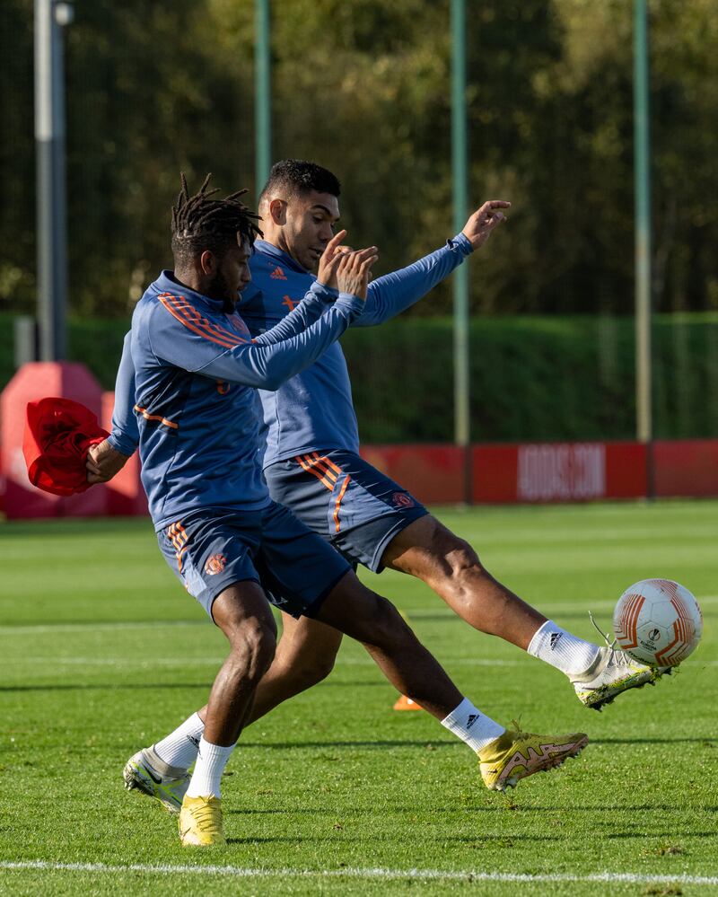 Casemiro and Fred battle it out in training.