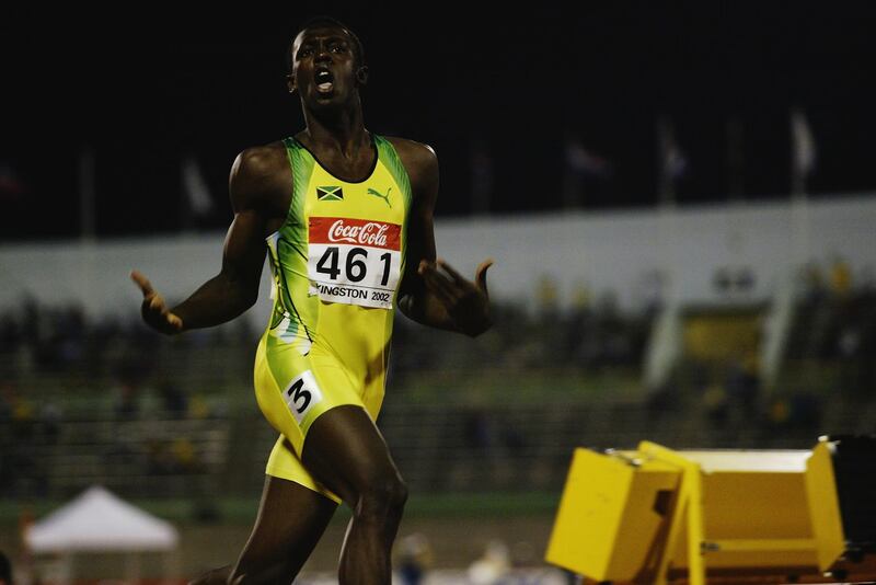 KINGSTON - JULY 18:  Usain Bolt of Jamaica celebrates winning the 200 metres final during the IAAF Junior Athletics World Championships on July18, 2002 at the National Stadium in Kingston, Jamaica.  (Photo by Andy Lyons/Getty Images)