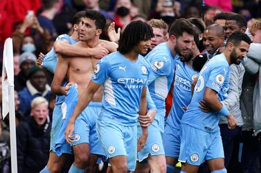 Manchester City's Rodri (left) celebrates with team-mates after scoring their side's second goal of the game during the Premier League match at the Emirates Stadium, London. Picture date: Saturday January 1, 2022.
