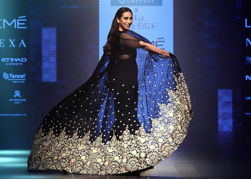 Actress Karishma Kapoor dons a sari for designer Arpita Mehta. AFP