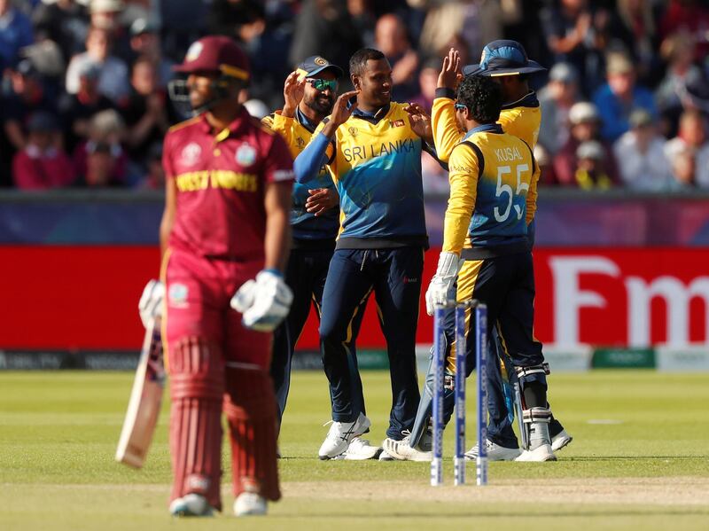 Cricket - ICC Cricket World Cup - Sri Lanka v West Indies - Emirates Riverside, Chester-Le-Street, Britain - July 1, 2019   Sri Lanka's Angelo Mathews celebrates with team mates after taking the wicket of West Indies' Nicholas Pooran   Action Images via Reuters/Lee Smith