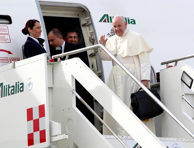 Pope Francis boards the airplane before departing for Abu Dhabi. EPA