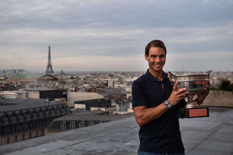 Spain's Rafael Nadal holds the Mousquetaires Cup (The Musketeers) during a photocall. AFP