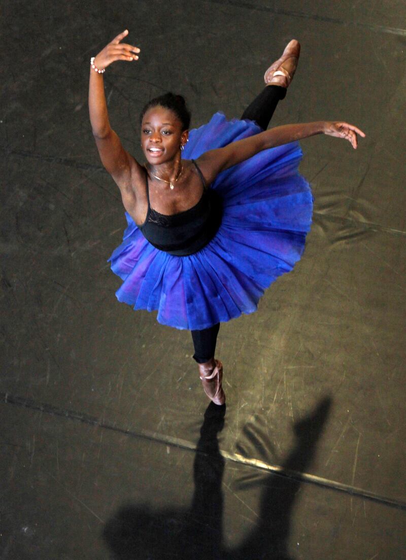 FILe - In this July 10, 2012 file photo, dancer Michaela DePrince rehearses for her lead role in Le Corsaire in Johannesburg. Pop Star Madonna will direct a film based on  DePrince's memoir â€œTaking Flight: From War Orphan to Star Ballerina.â€ DePrince overcame a childhood in war-stricken Sierra Leone to become a world class ballerina. (AP Photo Denis Farrell, File)