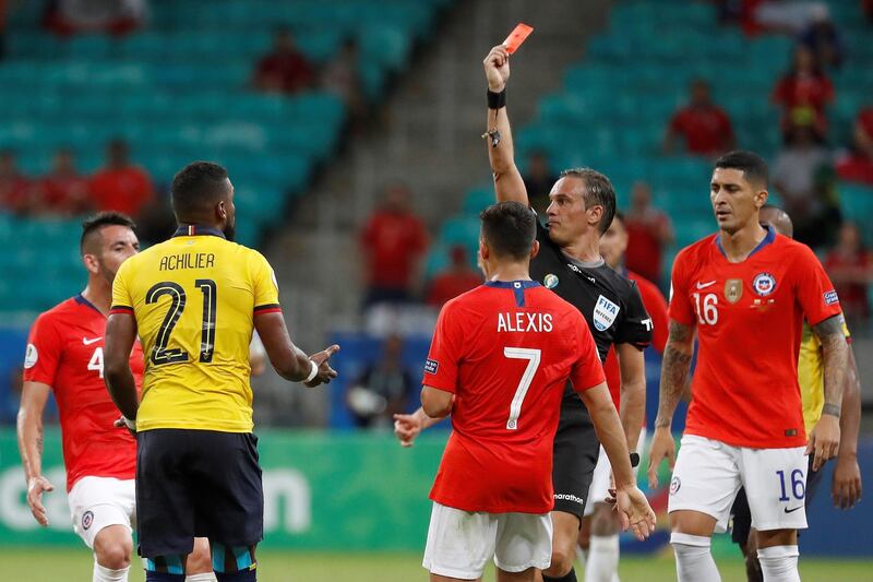 Ecuador's Gabriel Achilier receives a red card toward the end of the Copa America game against Chile. EPA
