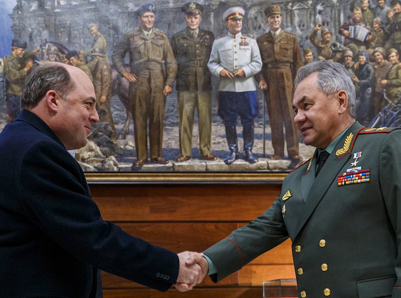 Mr Wallace and Russian Defence Minister Sergei Shoigu shake hands during their February meeting in Moscow. EPA