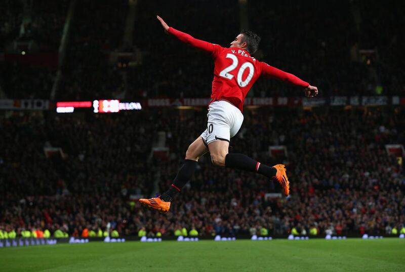 Robin van Persie of Manchester United celebrates scoring his team's third goal against Hull City on Tuesday. Alex Livesey / Getty Images / May 6, 2014