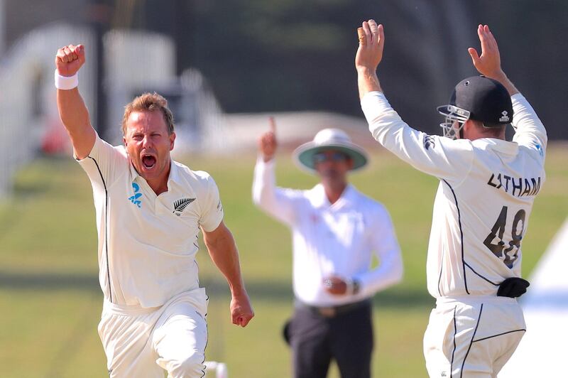 New Zealand bowler  Neil Wagner, left, celebrates after dismissing England's Stuart Broad to win the first Test at Mount Maunganui. AFP