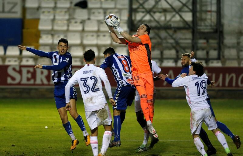 Real Madrid goalkeeper Andriy Lunin catches the ball. EPA