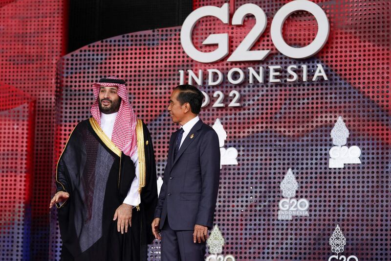 Saudi Arabia's Crown Prince Mohammed talks with Indonesia's Mr Widodo. AFP
