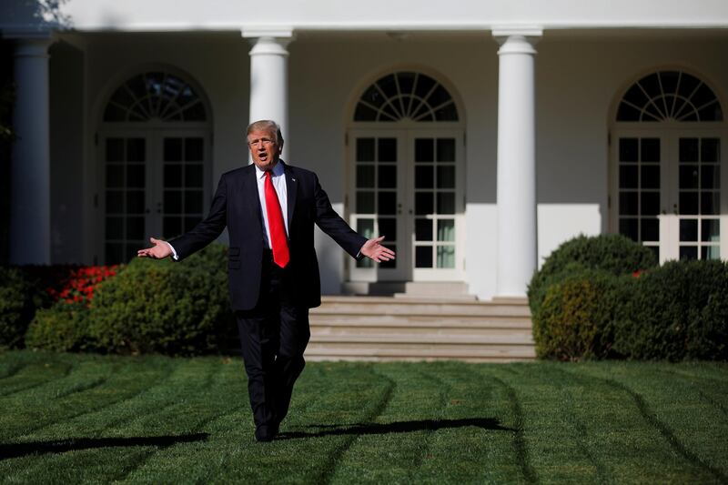 U.S. President Donald Trump talks to members of the press pool at the Rose Garden of the White House in Washington, U.S., September 15, 2017. REUTERS/Carlos Barria