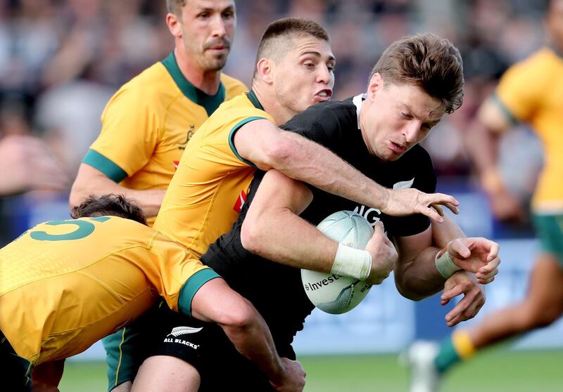 Australia's James O’Connor tackles New Zealand's Beauden Barrett. AFP