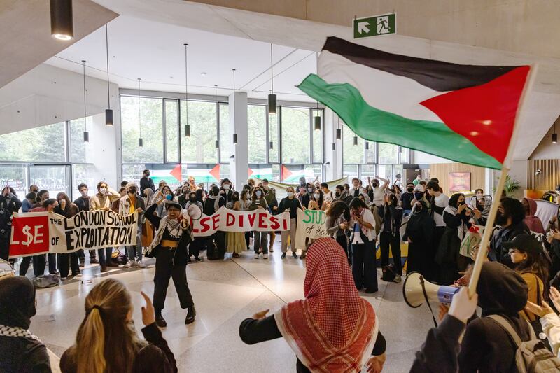 Members of the student union's Palestine Society occupy the Marshall Building at the London School of Economics. Getty Images