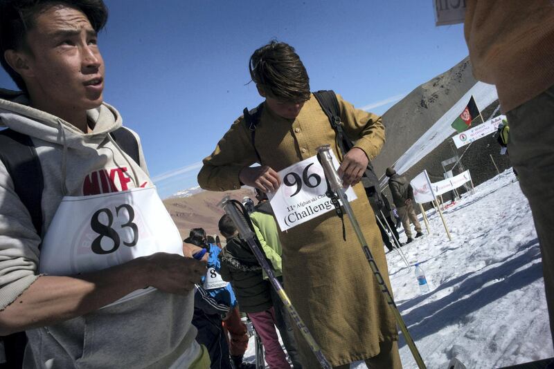 AFGHANISTAN, Bamiyan: 05 March 2021
Pictures from the annual Afghan Mountain Challenge - a ski event held in Bamiyan Province, 80 miles west of Kabul. Participants have to run up the mountain via specific checkpoints and then proceed to ski down. 
Pictured - participants get ready. Rick Findler for The National