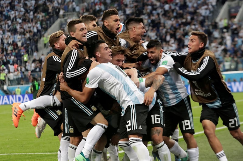 Argentina's Marcos Rojo celebrates scoring their second goal with team mates. Henry Romero / Reuters