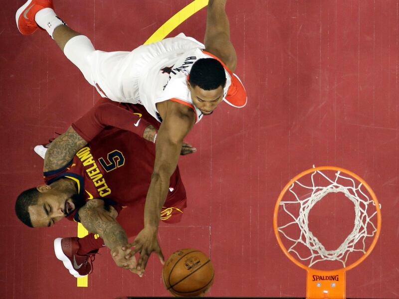Cleveland Cavaliers' JR Smith drives to the basket against Portland Trail Blazers' Maurice Harkless. Tony Dejak / AP Photo