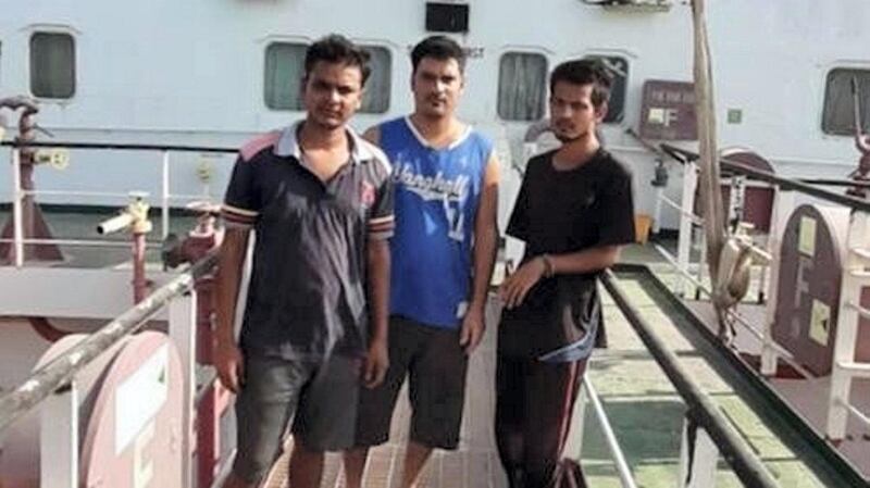 Seafarers onboard the Mt Iba anchored off the Dubai coast hope lifting of Covid-19 maritime restrictions will soon allow them to return home after more than three years at sea. From left, cook Monchand Shaikh, second engineer Vinay Kumar and ordinary seaman Nirmal Singh, all from India. Courtesy: Nay Win 