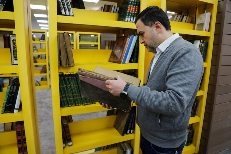 A man checks the books inside the new-look library. Reuters