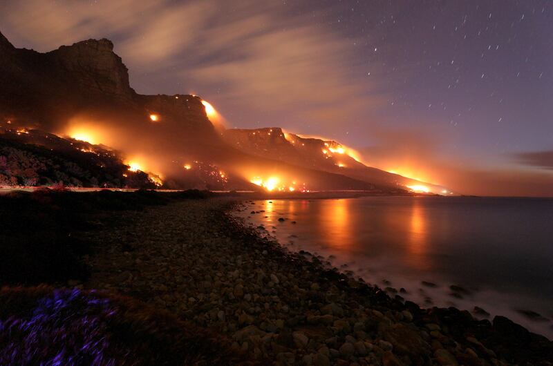 Wildfires burn along the Twelve Apostles area of Table Mountain in Cape Town, South Africa. Mike Hutchings / Reuters.