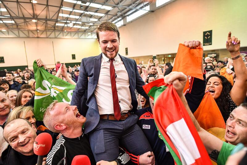 Sinn Fein's Donnchadh Ó Laoghaire celebrates being the first TD elected to the 33rd Dáil, topping the poll ahead of Micheál Martin, Simon Coveney and Michael McGrath at Nemo Rangers GAA Club on February 9, 2020 in Cork, Ireland. Getty Images