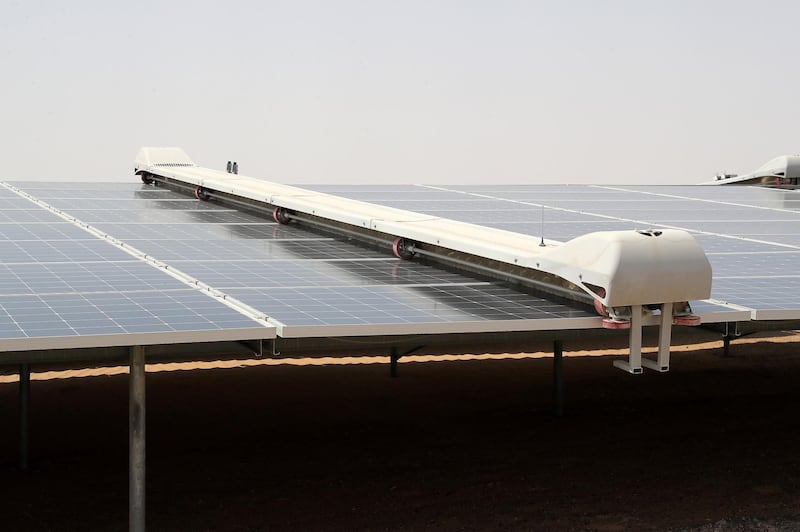 ABU DHABI,  UNITED ARAB EMIRATES , OCTOBER 1 – 2019 :- Robot cleaner cleaning the solar panels at the Noor Solar Power Plant in Sweihan in Abu Dhabi. ( Pawan Singh / The National ) For News. Story by Daniel