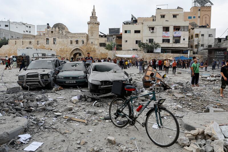 Palestinians inspect damage in the aftermath of Israeli strikes in Khan Younis, southern Gaza Strip. Reuters