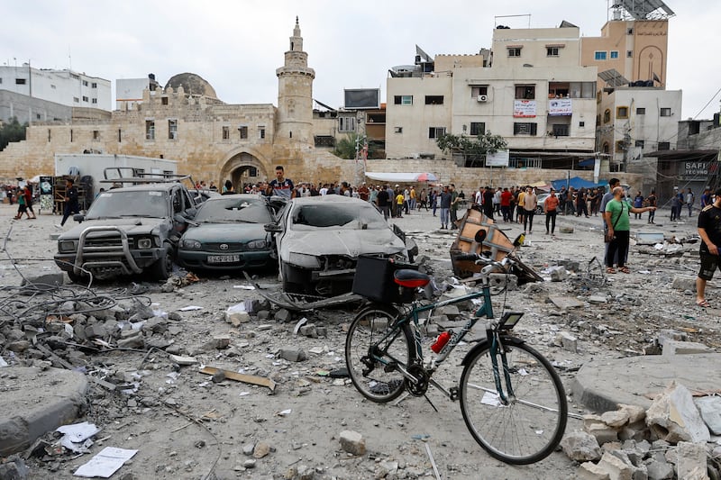 Palestinians inspect damage in the aftermath of Israeli strikes in Khan Younis, southern Gaza Strip. Reuters