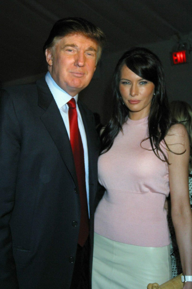 Millionaire speculator Donald Trump and his girlfriend Melania Knauss pose at the entrance of the Oscar de la Renta Spring-Summer 2004 fashion show, during the Fashion Week at Bryant Park, New York, 15 September 2003. EPA PHOTO/EFE/Miguel Rajmil//