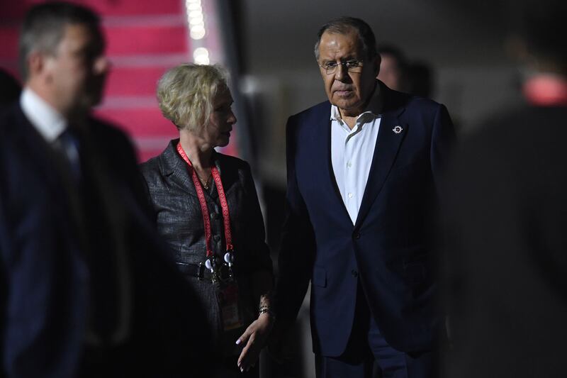 Russian Foreign Minister Sergey Lavrov, right, talks to Russian Ambassador to Indonesia Lyudmila Vorobyova upon his arrival to attend the G20 Summit at Ngurah Rai International Airport in Bali. AP