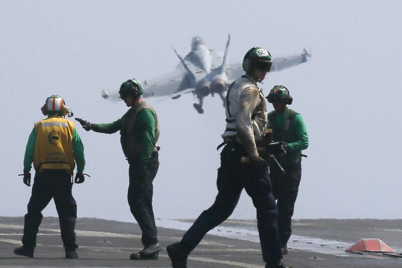 A US navy F18 fighter jet takes off from the navy aircraft carrier USS Carl Vinson for a patrol off the disputed South China Sea on March 3, 2017. The US military took journalists Friday to the carrier, which was on routine patrol off the disputed South China Sea, sending a signal to China and American allies of its resolve to ensure freedom of navigation and overflight in one of the world’s security hotspots. Bullit Marquez / Associated Press