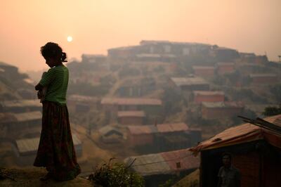 FILE PHOTO: A Rohingya refugee is seen in Balukhali refugee camp at dawn near Cox's Bazaar, Bangladesh, March 28, 2018. REUTERS/Clodagh Kilcoyne//File Photo