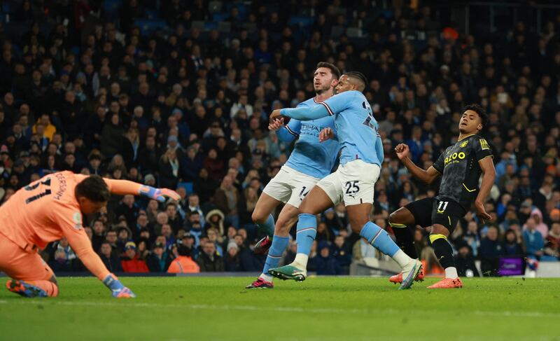 Aston Villa's Ollie Watkins scores past Ederson. Reuters