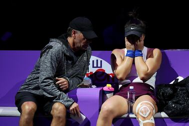SHENZHEN, CHINA - OCTOBER 30: Bianca Andreescu of Canada speaks to her coach Sylvain Bruneau after sustaining an injury to her left leg during a break in her Women's Singles match against Karolina Pliskova of the Czech Republic on Day Four of the 2019 Shiseido WTA Finals at Shenzhen Bay Sports Center on October 30, 2019 in Shenzhen, China. (Photo by Matthew Stockman/Getty Images)