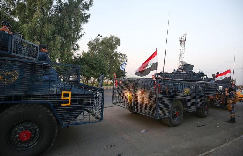 Iraqi police are seen deployed in Baghdad's predominantly Shiite Sadr City. Demonstrations across Baghdad and the south have spiralled into violence over the last week, with witnesses reporting security forces using water cannons, tear gas and live rounds and authorities saying "unidentified snipers" have shot at protesters and police. On Sunday evening a mass protest in Sadr City in east Baghdad led to clashes that medics and security forces said left 13 people dead. AFP